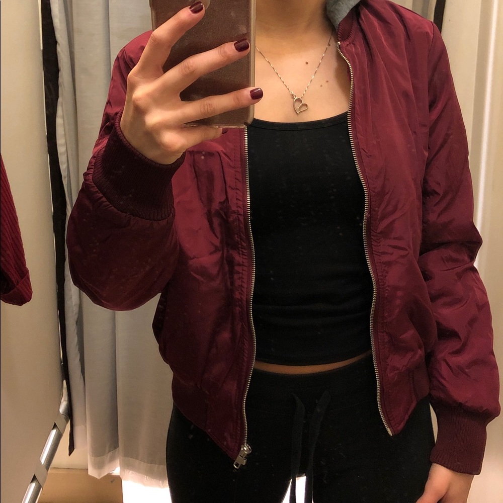 Maroon jacket with gray hood